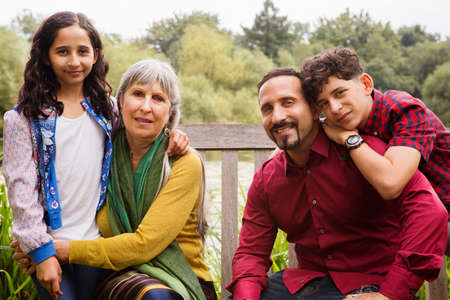 Portrait of three generation family, outdoors