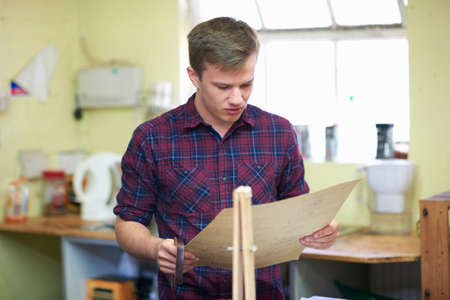 Male worker in leather workshop