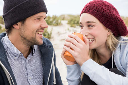 Young couple picnicking on beach, Western Cape, South Africaの写真素材