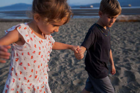 Children playing on beach, Vancouver, British Columbia, Canada