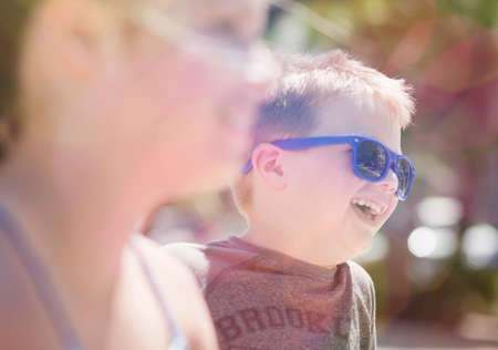 Brother and sister laughing togetherの写真素材