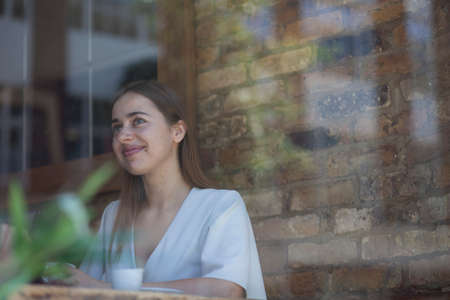 Businesswoman having meeting in coffee bar, Londonの写真素材