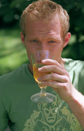 Young male drinking from glass