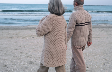 Senior couple walking near sea