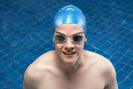 Portrait of a male swimmer in a pool