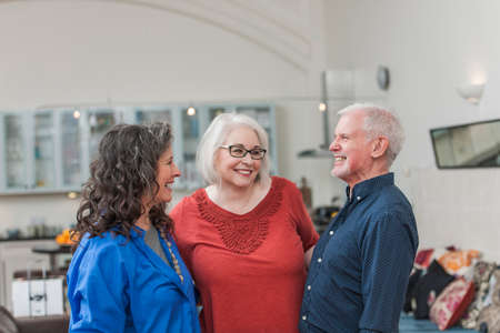 Happy seniors chatting at homeの写真素材