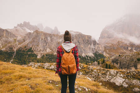 Hiker looking out at Mount Lagazuoi, Dolomite Alps, South Tyrol, Italyの写真素材