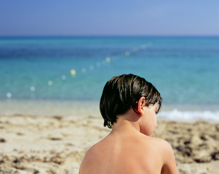 Boy by the seaの写真素材