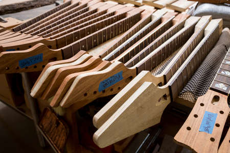 Headstocks and necks of guitars in workshop