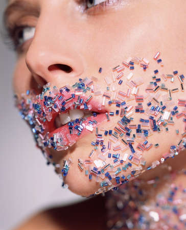 Woman with beads on her face