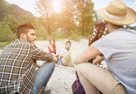 Friends sitting having picnic