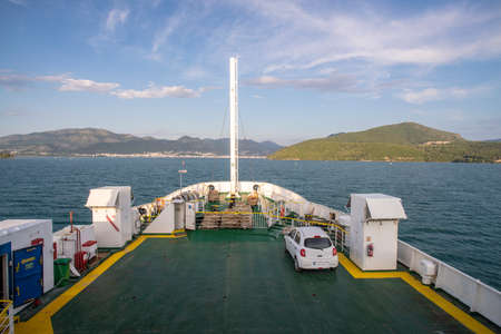 Greece, Igoumenitsa, Deck of ferry in sea heading to coastの写真素材