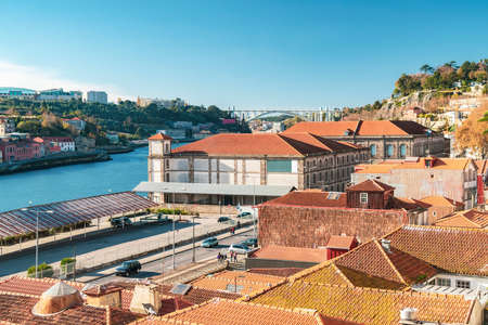 Portugal, Porto, Rooftops of old town buildings and Douro riverの写真素材