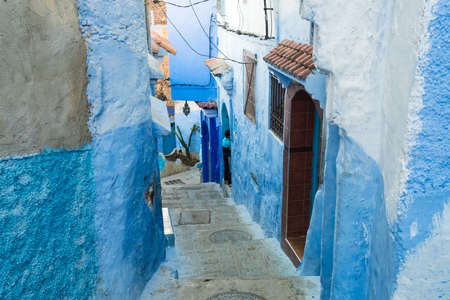 Morocco, Chefchaouen, Narrow alley and traditional blue housesのeditorial素材