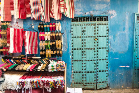 Morocco, Chefchaouen, Textiles and slippers for sale on soukのeditorial素材