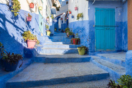 Morocco, Chefchaouen, Narrow alley and traditional blue housesのeditorial素材