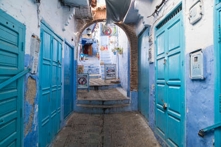 Morocco, Chefchaouen, Narrow alley and traditional blue housesのeditorial素材