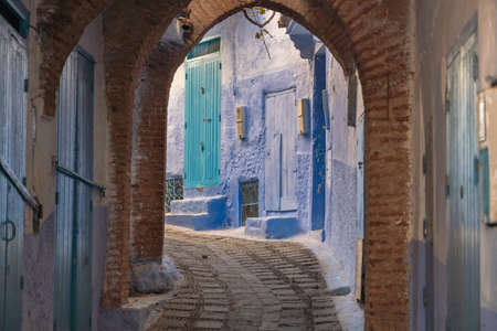 Morocco, Chefchaouen, Narrow alley and traditional blue housesのeditorial素材