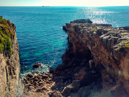 Cliff oceanfront atlantic with stones, beautiful sky and sea deep blue.の写真素材