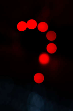 Question mark make with red light in abstract background. Neon light night discussion.の写真素材