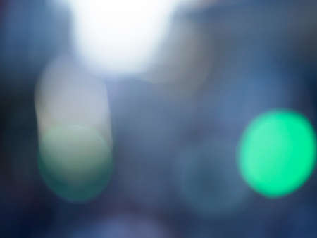 Lights bokeh of focus at night in the city. Dazzle concept.の写真素材