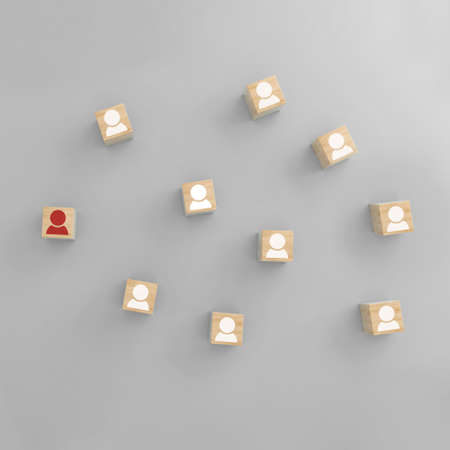 Networking of wooden cubes with people icon on grey background. Leadership, team building concepts....