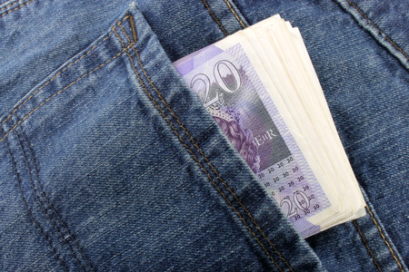 A close up of Sterling notes in a back pocket 