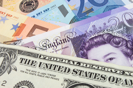 A close-up photograph of  United States and Euro and Sterling currency の写真素材
