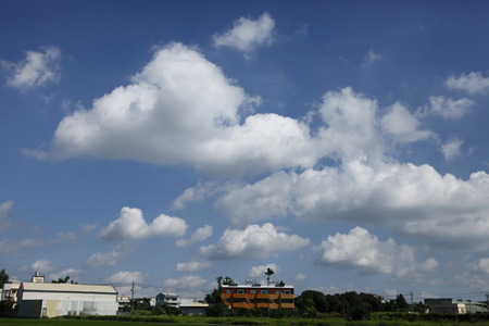 Under sunny blue sky and white cloudsのeditorial素材