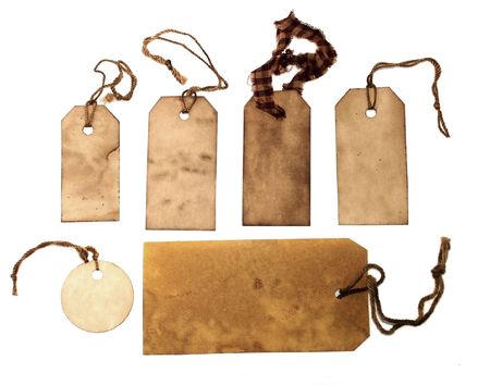 Old stained tags with stringsの写真素材