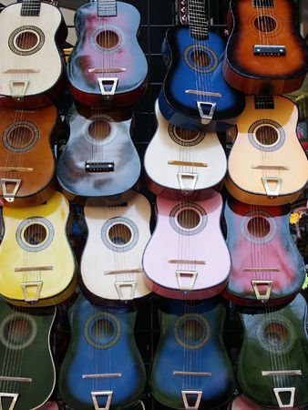 Wall of colorful guitars for background
