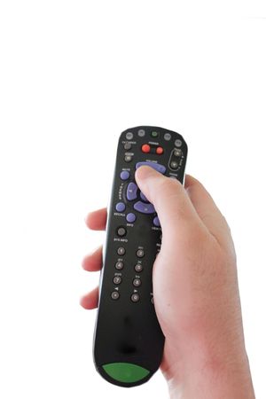 TV remote in a hand, isolated on whiteの写真素材