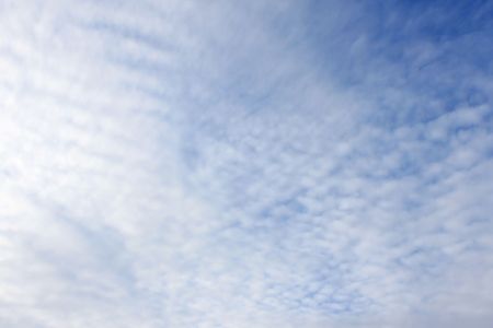 Puffy white clouds on a blue skyの写真素材