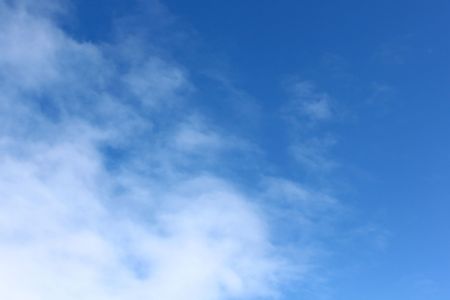 Puffy white clouds on a blue skyの写真素材