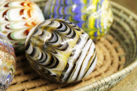 Marble eggs in a basketの写真素材