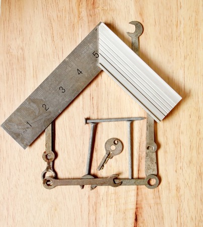 House made from small tools on woodの写真素材