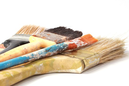 Dirty paint brushes on white background
