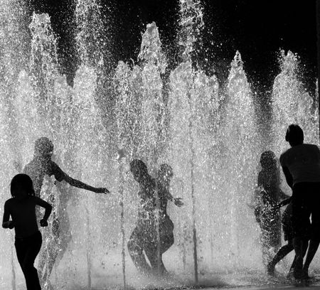 CHILDREN PLAYING IN WATERの写真素材