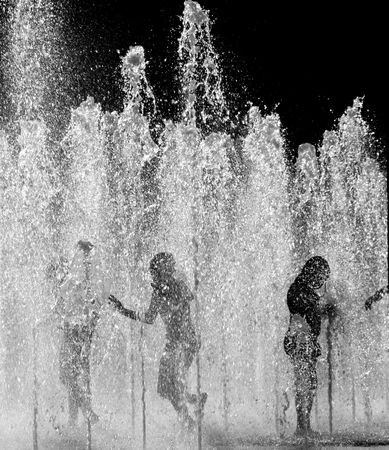 CHILDREN PLAYING IN WATERの写真素材