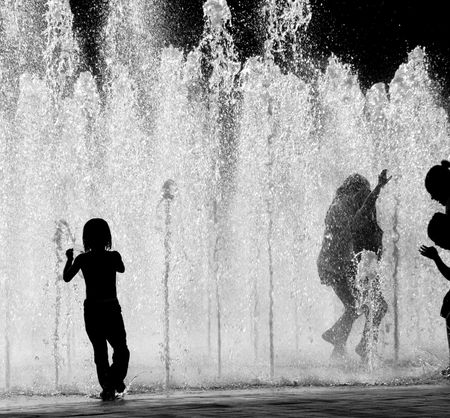 CHILDREN PLAYING IN WATERの写真素材
