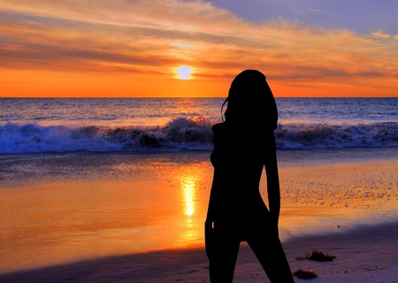 Woman at the  beach Silhouetteの写真素材
