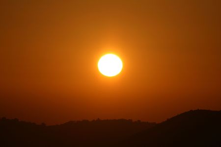 Sun Setting over Serengeti Wildlife Conservation Area, Safari, Tanzania, East Africaの写真素材