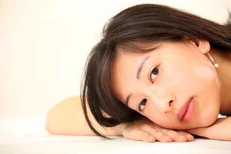 Beautiful Young Female Model in Isolated Studio Settingの写真素材