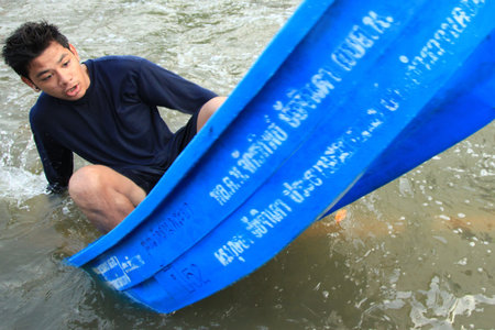 BANGKOK, THAILAND - NOVEMBER 17 : Man in emergency boat after the heaviest rains in 20 years in...