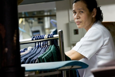 Woman working at factory in Bangkok City, Thailandのeditorial素材
