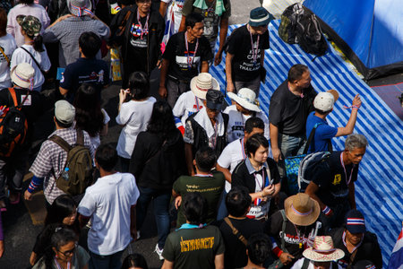 BANGKOK - JANUARY 13 2014: Protesters against the government rally together at Siam Center in...