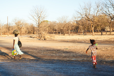 LIVINGSTONE - OCTOBER 14 2013: Local people in the town center of Livingstone, Zambia, Africaのeditorial素材