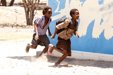 KATIMA MULILO, NAMIBIA - OCTOBER 16 2013: Kids playing during a year of drought in the North Eastern town of Katima Mulilo in Namibia, Africaのeditorial素材