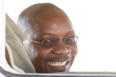 ETOSHA, NAMIBIA - OCTOBER 27 2013: Local tour guides smile as they take a trip in a year of drought at Etosha National Park, Namibia, Africaのeditorial素材