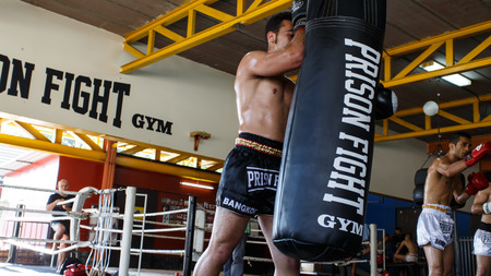 THAILAND - FEBUARY 11 2014: International fighters take part in warmup training for the upcoming Prison Fight round 6 competition in Khlong Phai Prison, Thailandのeditorial素材